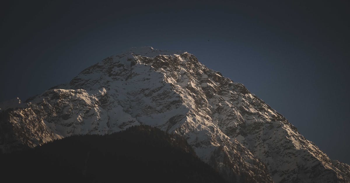 Climbing Mount Aragats in October - Snowy mountain peaks under dark blue sky