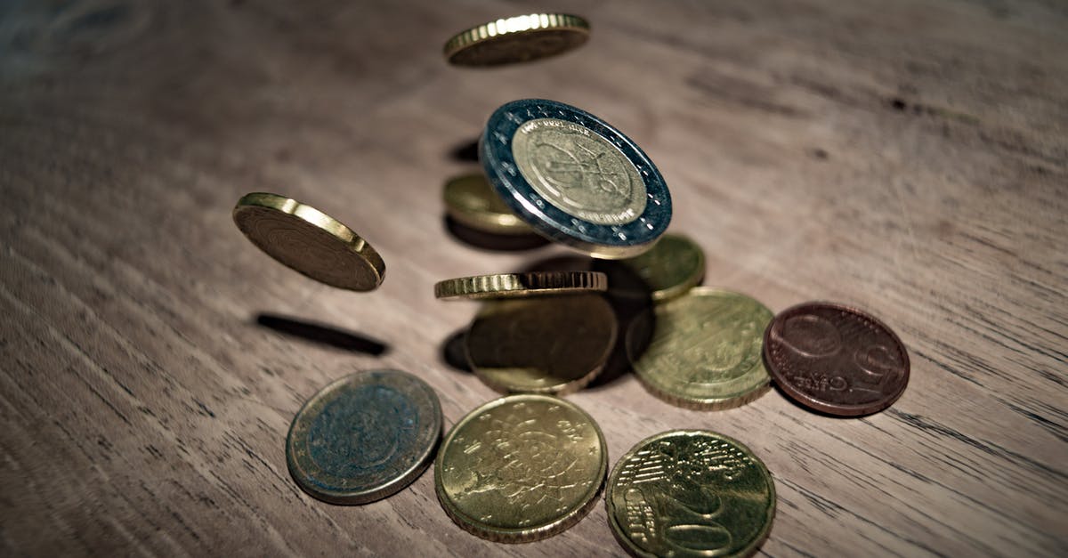 Collecting euro coins of European microstates [closed] - Close-up of Coins on Table