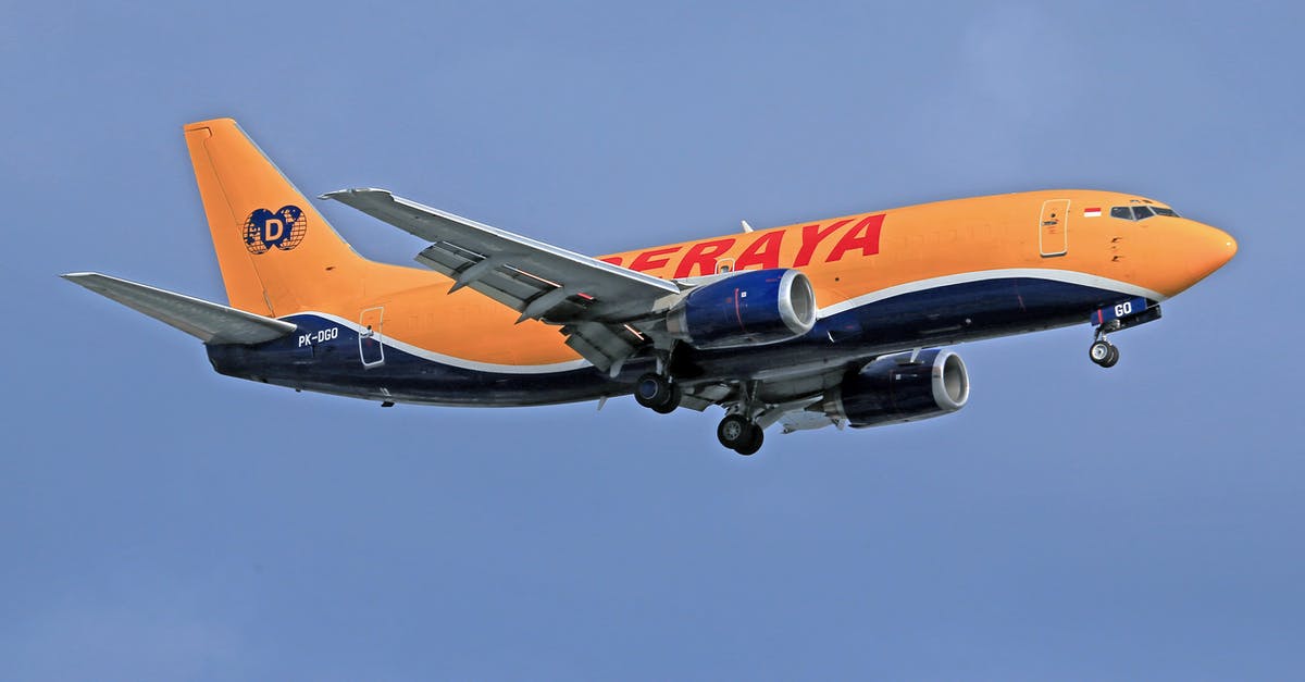 Combining plane tickets - Orange and White Passenger Plane in the Sky