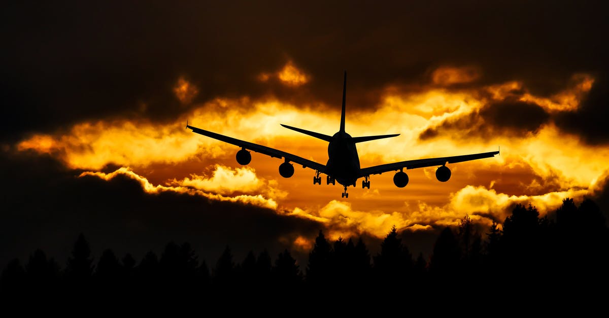 Compensation for United Airlines 5-hour flight delay - Airplane Silhouette on Air during Sunset