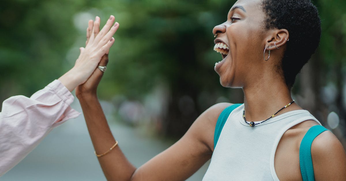 Comprehensive health and travel insurance that meets NZ Immigration requirements - Happy Woman Doing A High Five