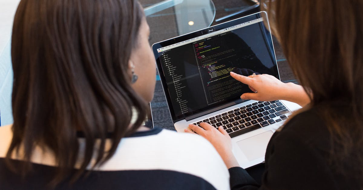 Computer programming while travelling - what configuration? [closed] - Two Women Looking at the Code at Laptop