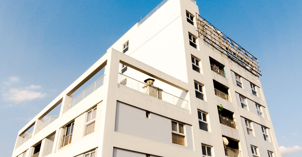 Concrete building in Kharkiv - White Concrete Building Under Blue Sky