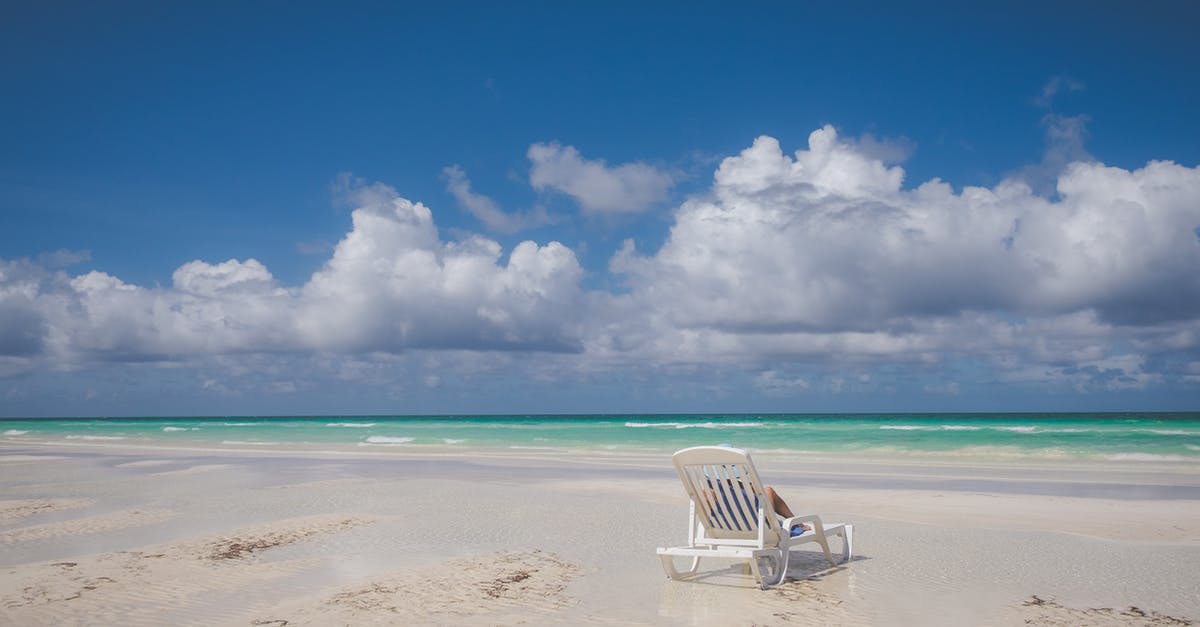 Confirming that Santiago de Cuba to Dominican Republic route exists - White and Blue Beach Chairs on Beach