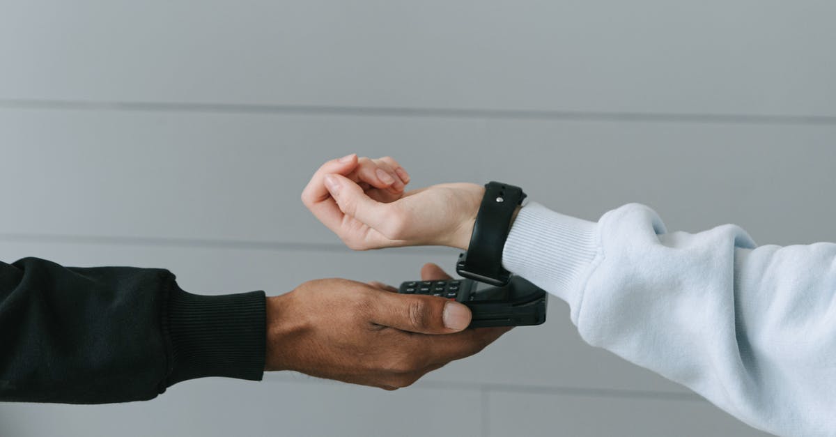 Connecting between terminal 1 and 2 at SFO - Person Paying Using Her Smartwatch