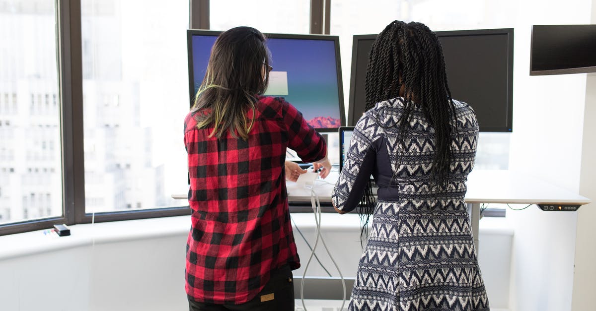 Connecting Flights - Two Women Standing in Front of Television