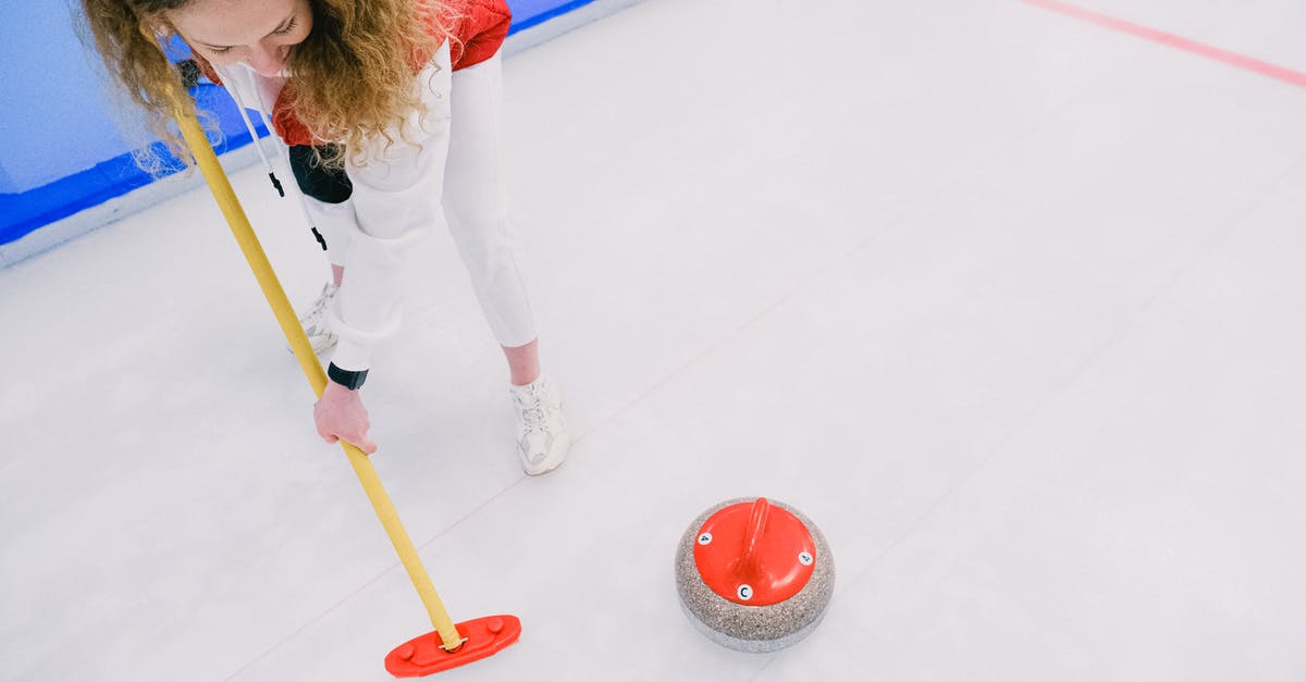 Connecting from ICE to regional trains (Deutsche Bahn) - Woman playing curling on ice sheet