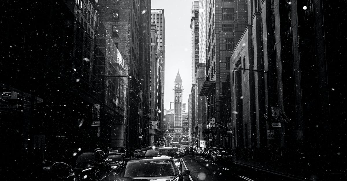 Connecting in Toronto on different airlines - Monochrome Photo Of City During Daytime