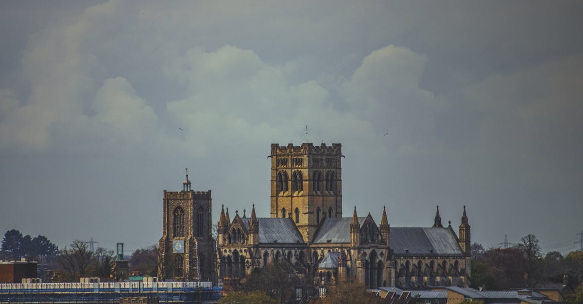 Connecting through UK when between UK visas - Brown and Gray Concrete Building Under White Clouds