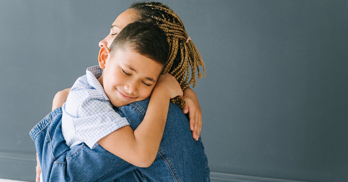 Consequences of accidentally holding onto two Indian passports simultaneously? - Mother and Son Hugging