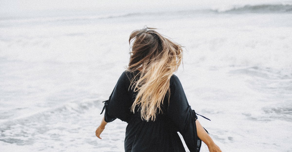 Cool weather destinations in Europe in August [closed] - Anonymous woman walking near waving sea