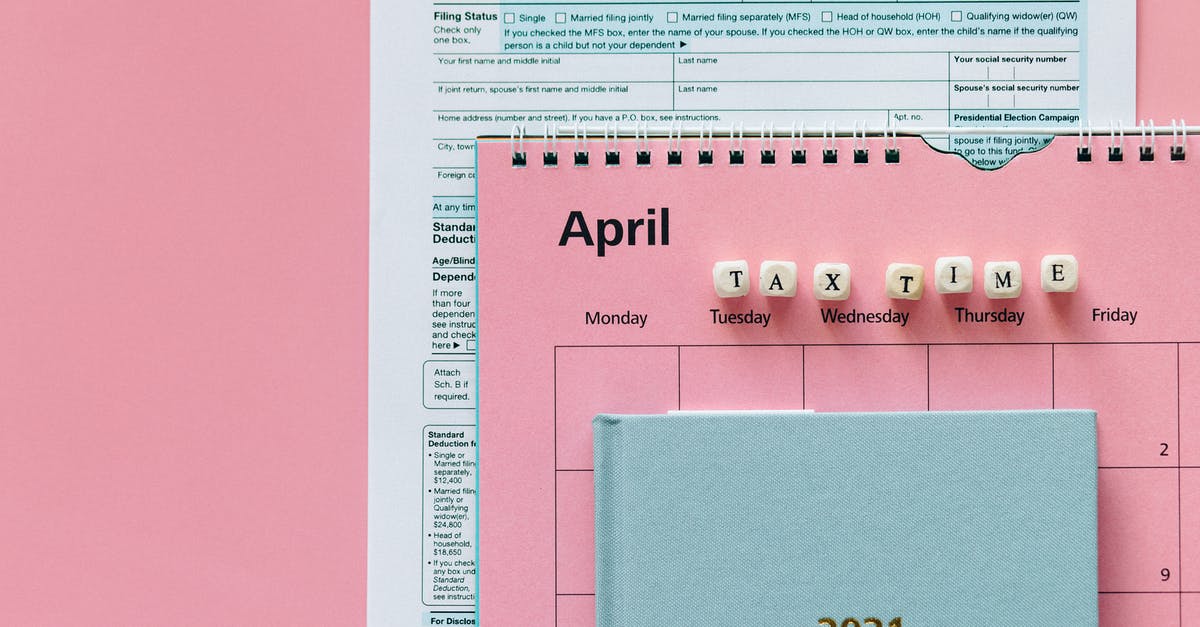 Co-ordinating a return and one-way ticket - Tax Return Form and 2021 Planner on Pink Surface