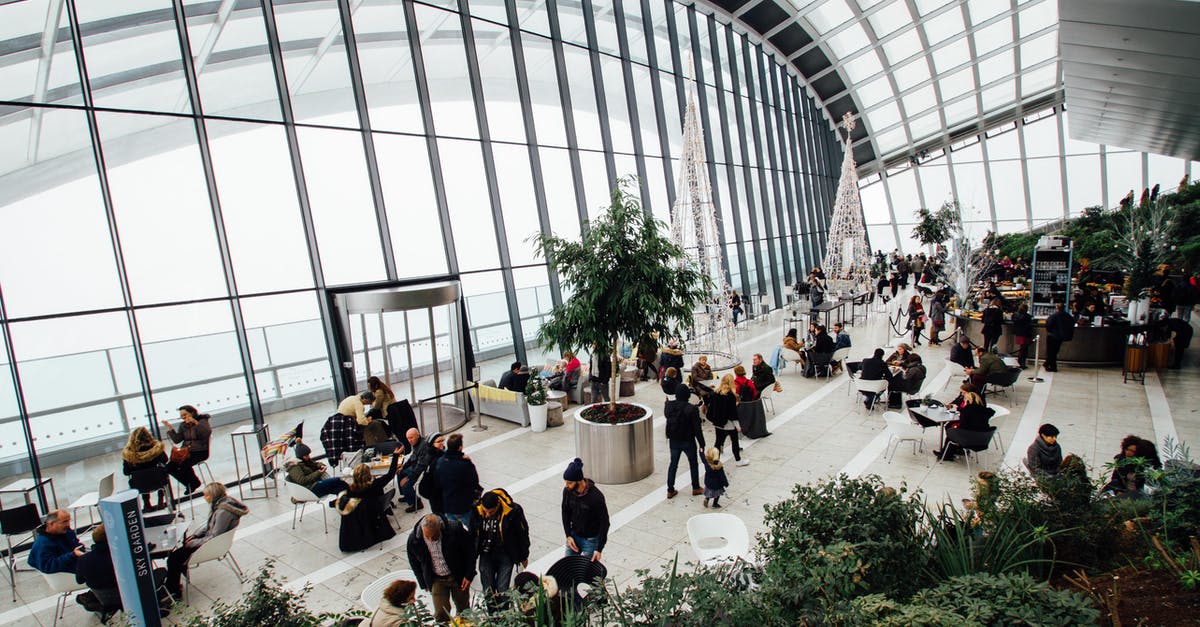 Cost-effective method of traveling from Luton Airport to Wembley, London - Group of People Inside Building