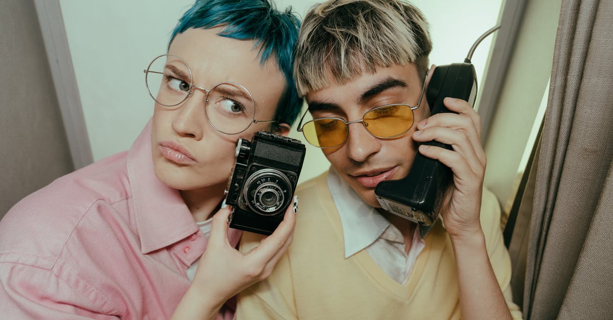 Costume photo booth in San Francisco - Woman in Pink Shirt Holding Black and Silver Camera