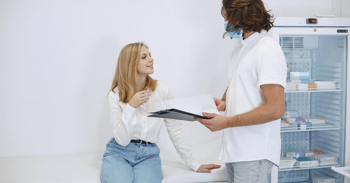 Couldn't attend booked appointment - Woman in White T-shirt and Blue Denim Jeans Holding Black Tablet Computer