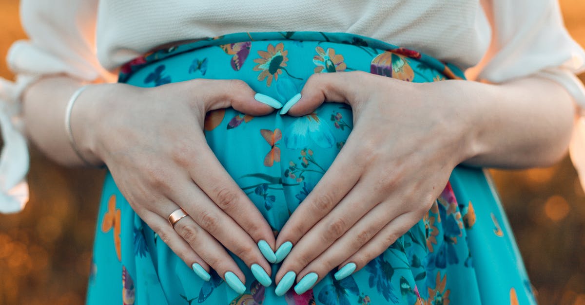 Country to live in for ~2 months when pregnant [closed] - Woman Making a Heart with Her Hands on Her Pregnant Belly 