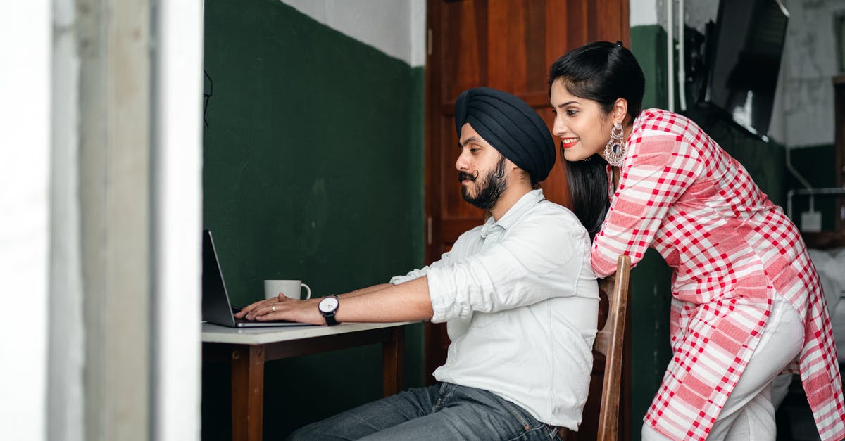 Cover letter for spouse travelling with husband on business visa - Young Indian spouses browsing netbook during online work