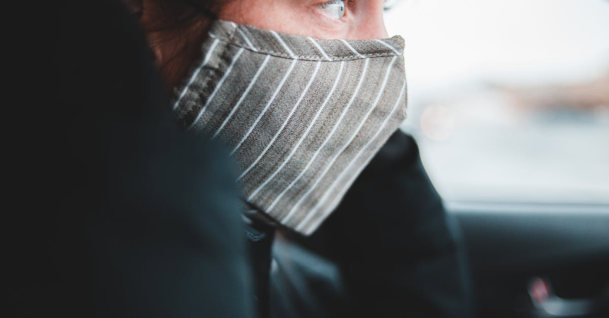 Covid-19 virus day by day chart? [closed] - Woman in mask sitting in car