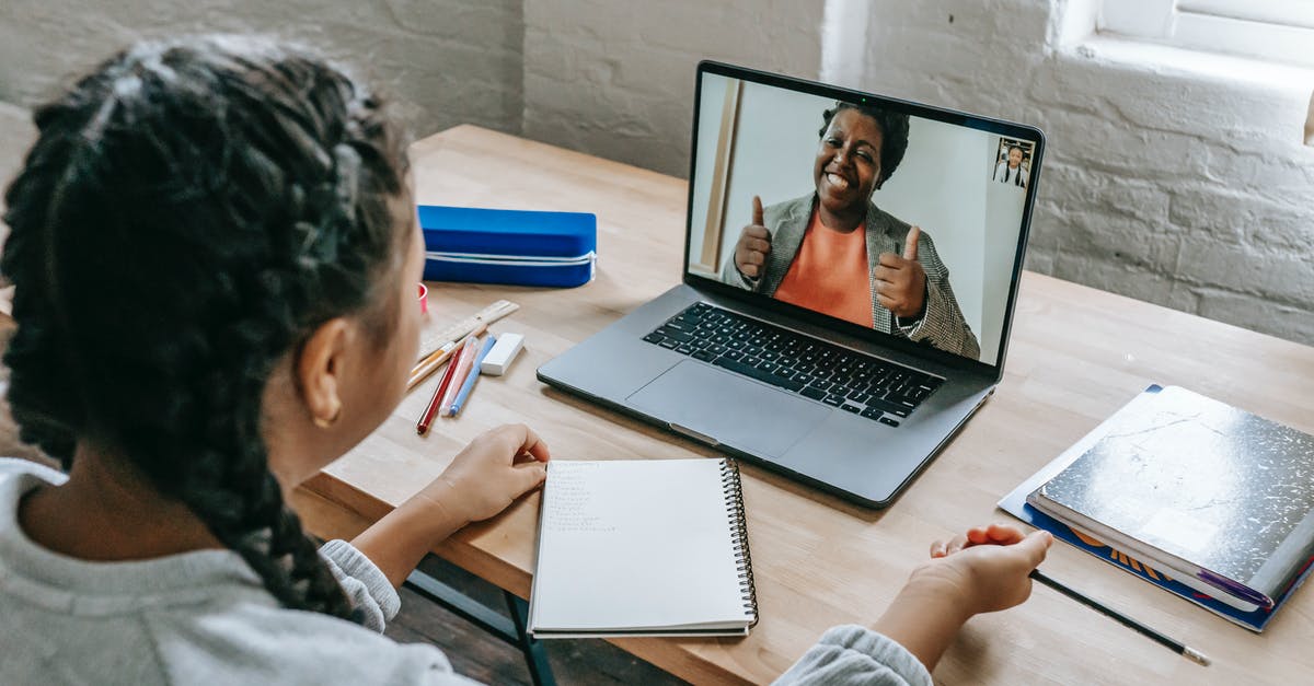 Covid restrictions based on originating or connecting locations? - Ethnic girl having video chat with teacher online on laptop