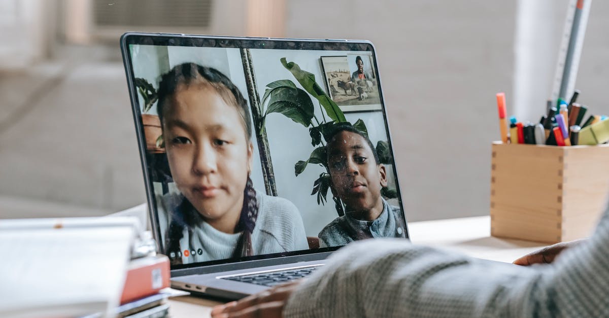 Covid restrictions based on originating or connecting locations? - Black tutor making video call with pupils