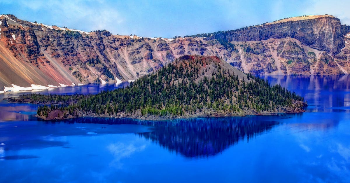 Crater Lake Oregon - can you sleep in your car at night? - Island on Blue Water Surrounded by Moutain