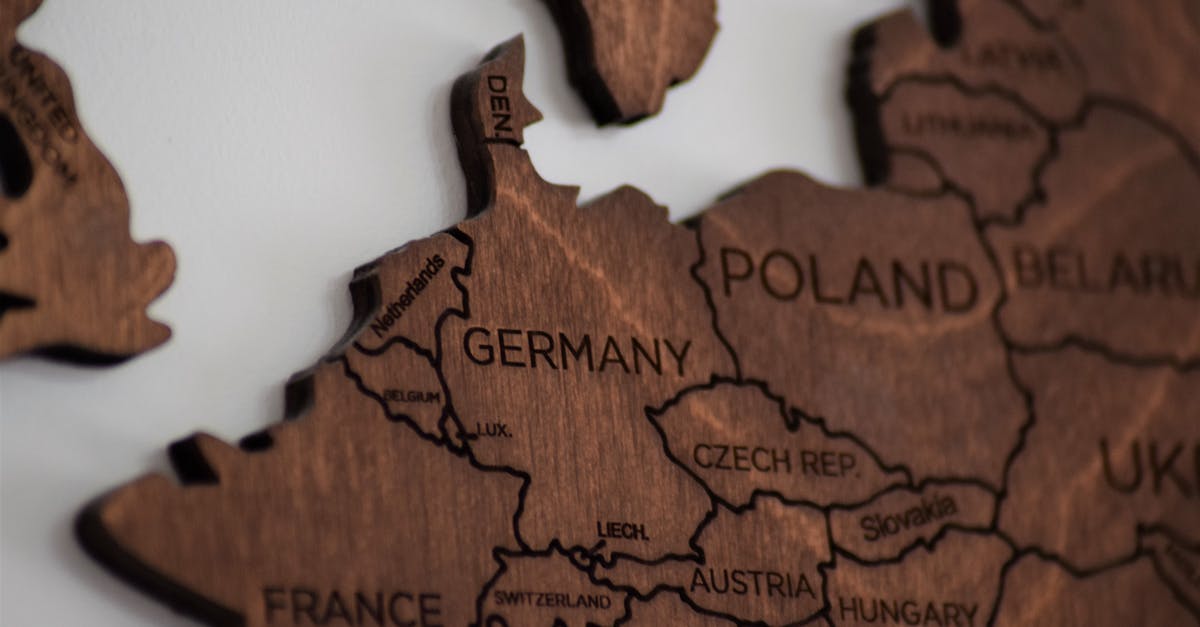 Crossing the border from Switzerland to France and back - Close-Up Photo of Wooden Jigsaw Map