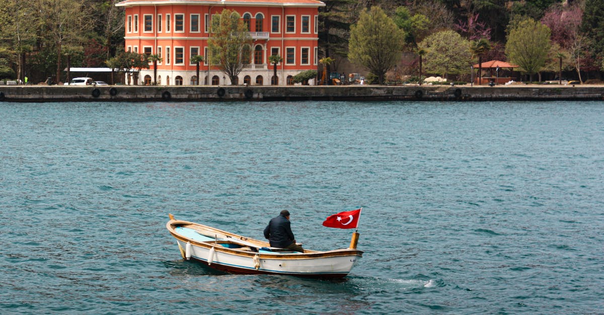 Crossing the Skadar Lake by boat or bicycle - Man sitting alone on a Boat 