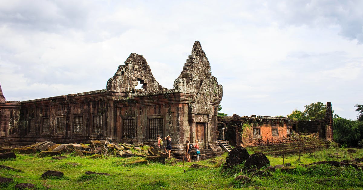 Currencies in Laos - Stone Castle Wall Surrounded With Green Grass