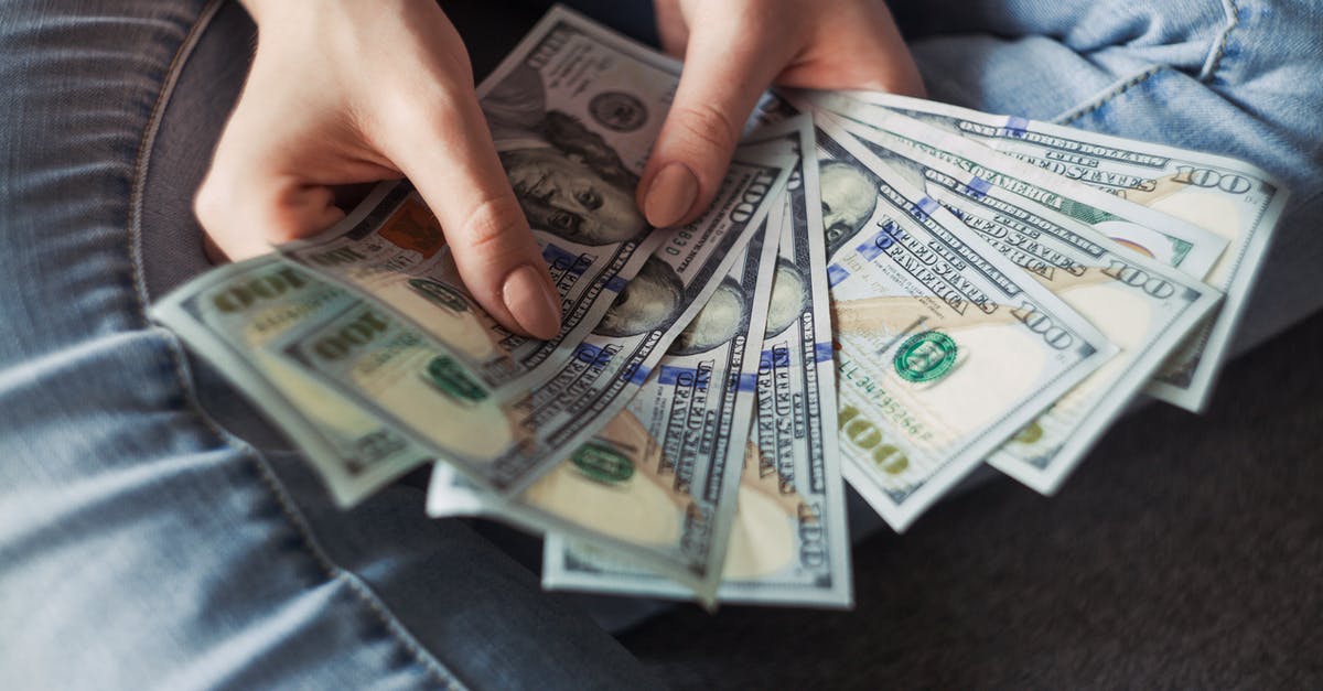 Currency exchange (USD to NTD and HKD) in San Francisco - Person Holding 100 Us Dollar Banknotes