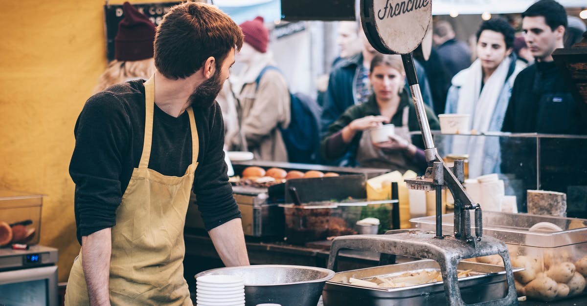 Custom Rules in Canada about bringing food - Man Standing in Front of Bowl and Looking Towards Left