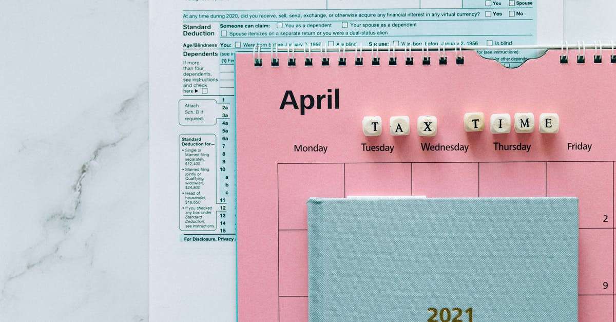 Customs officer stamp for one year - Tax Return Form and 2021 Planner on the Table