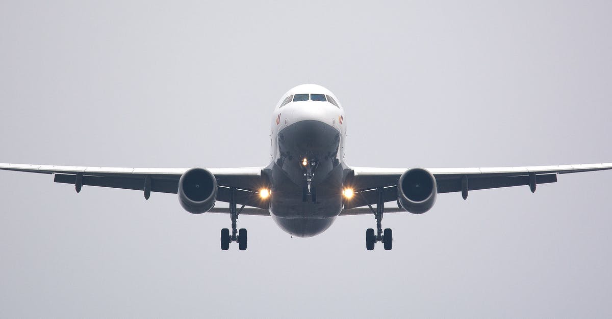 Cutting pain under eyebrow on plane landing - Time Lapse Photography of White Commercial Airplane