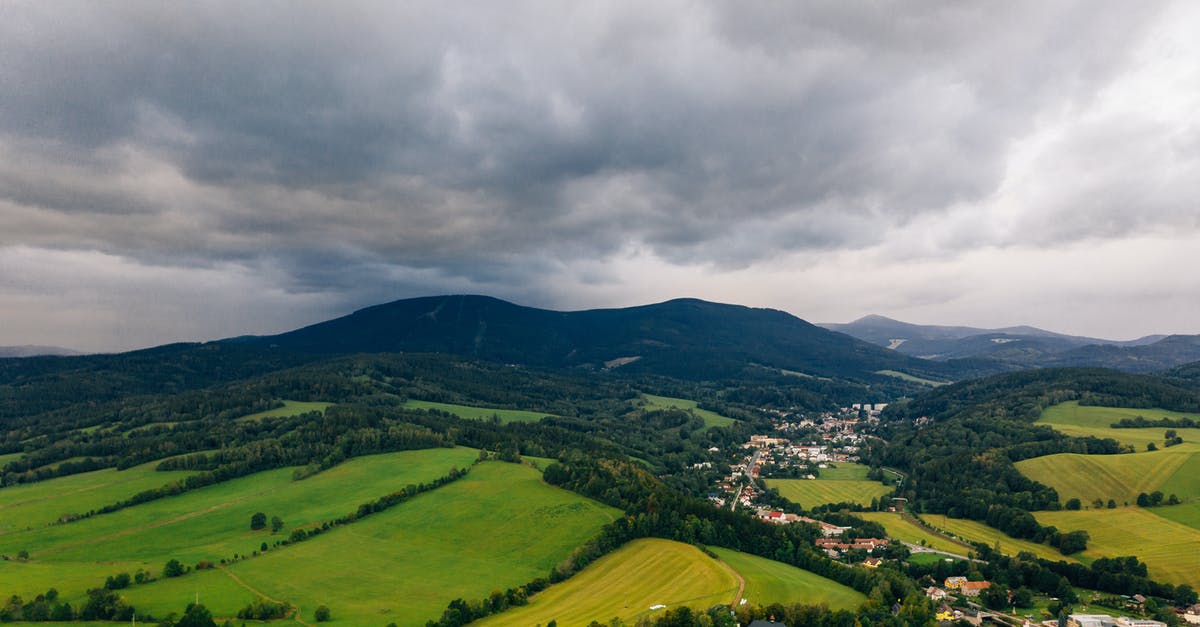 Czech Residency and Re-entering Schengen - Aerial Photo of A Town And Its Surrounding Landscape Under Cloudy Sky