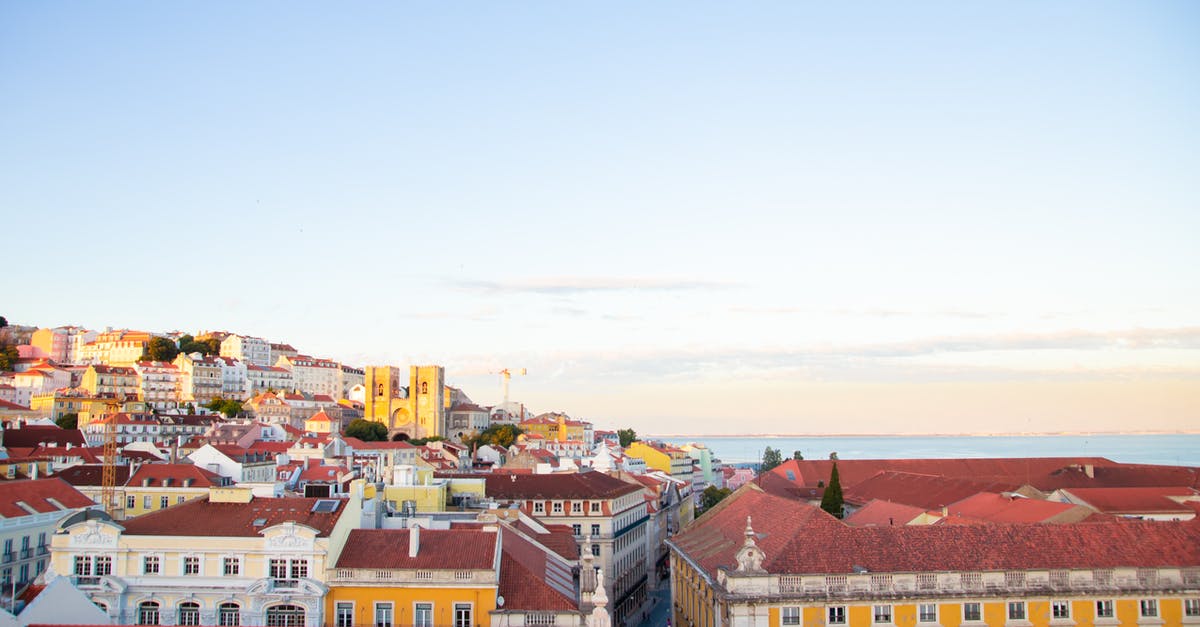 D2 Visa: Portugal Complexities [closed] - Lisbon residential district roofs in twilight