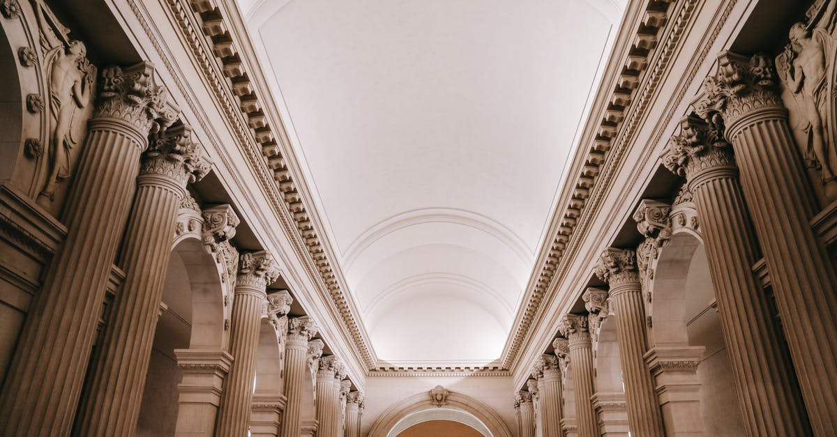 Daisetsuzan (Hokkaido, Japan) Grand Traverse, how hard? - Interior of grand classic palace passage with majestic stone colonnade beneath arched white ceiling and ornamental stucco works