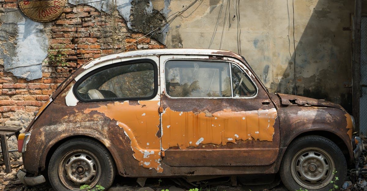 Damaged passport - Brown Car Parked Beside Brown Brick Wall