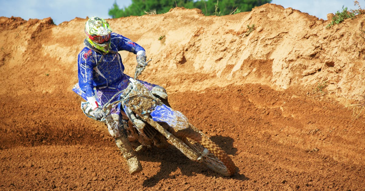 Danger zones in Austin, Texas - Man Riding Enduro Motocross on Sand Dune