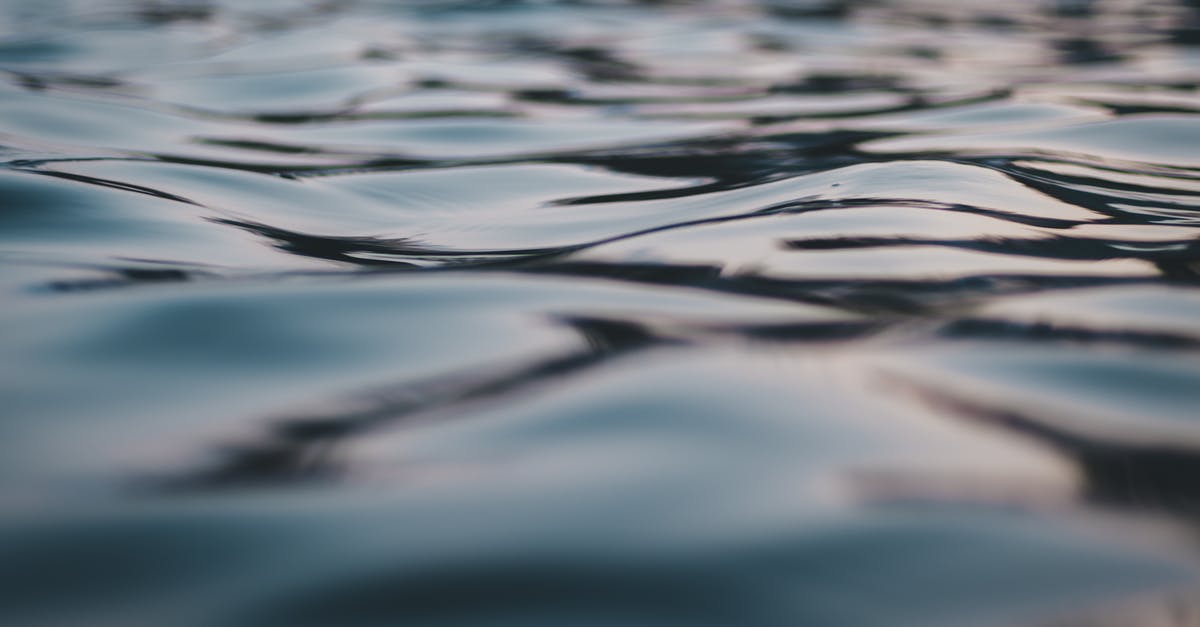 Day Tours from Within Kazbegi / Stepantsminda [closed] - High angle closeup of rippling water surface of sea reflecting sky on sunny day