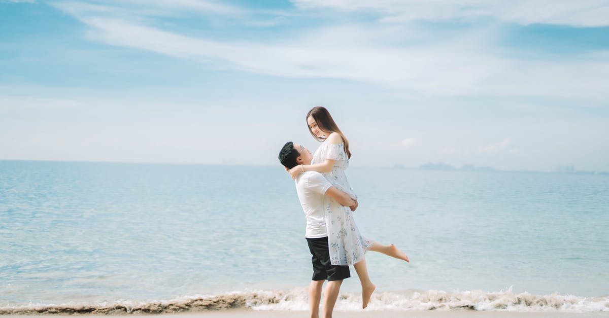 Day trip or weekend trip from Vientiane, Laos? - Happy couple enjoying vacation together on seashore