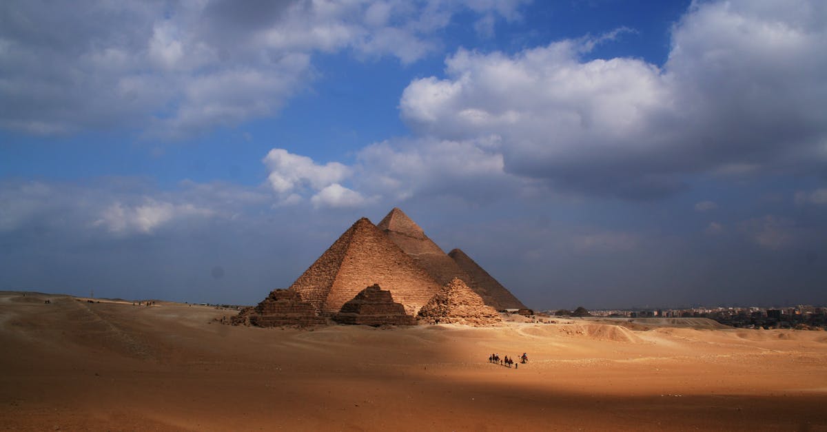 Dealing with extremely dry air in Africa - Amazing view of sandy dunes in desert with Pyramid of Cheops in Egypt