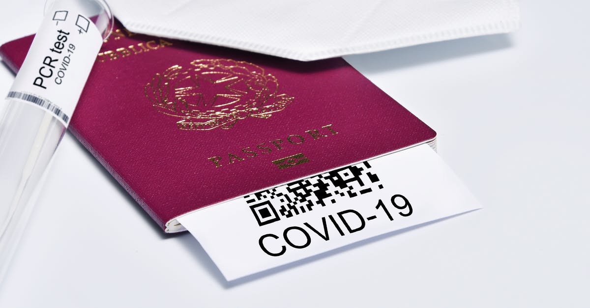 Declaring 'countries visited' at immigration after travelling with dual citizenship - COVID-19 and travel concept, mark of coronavirus PCR testing in tourist Italian passport.Diagnostics of coronavirus in airport due to lockdown. Business and tourism hit by corona virus during