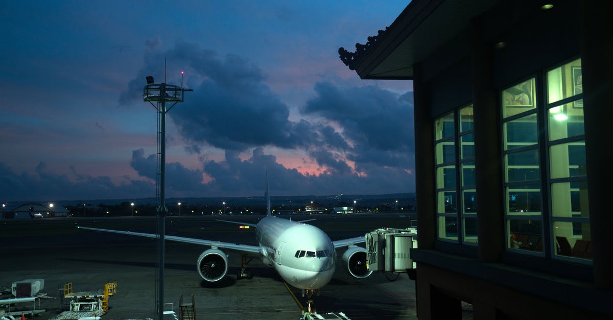 Delhi (IGI) Airport Domestic to International Terminal Transfer - Aircraft parked near airport terminal at night