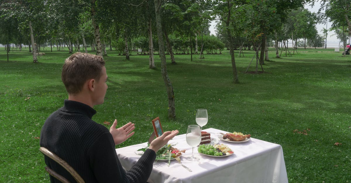 Did I miss something? - Man sitting at table served for two in park