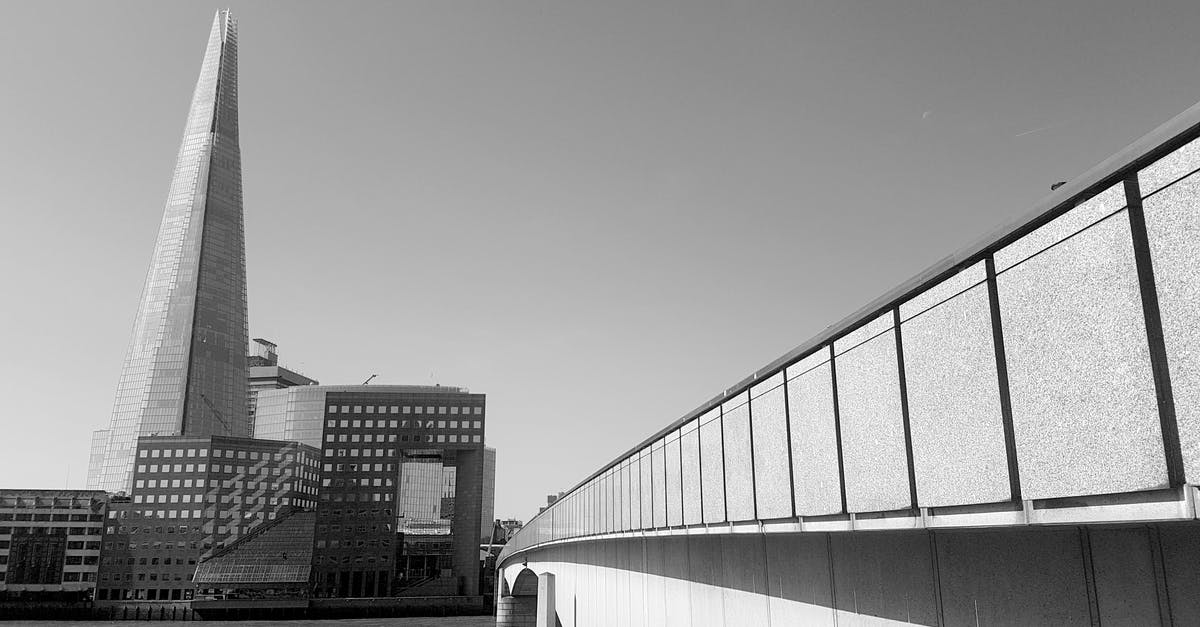 Did not declare travel partner in UK visa (business trip). How should I respond to immigration officer? - Grayscale Photography of Bridge Did not declare travel partner in UK visa (business trip). How should I respond to immigration officer? - Grayscale Photography of Bridge