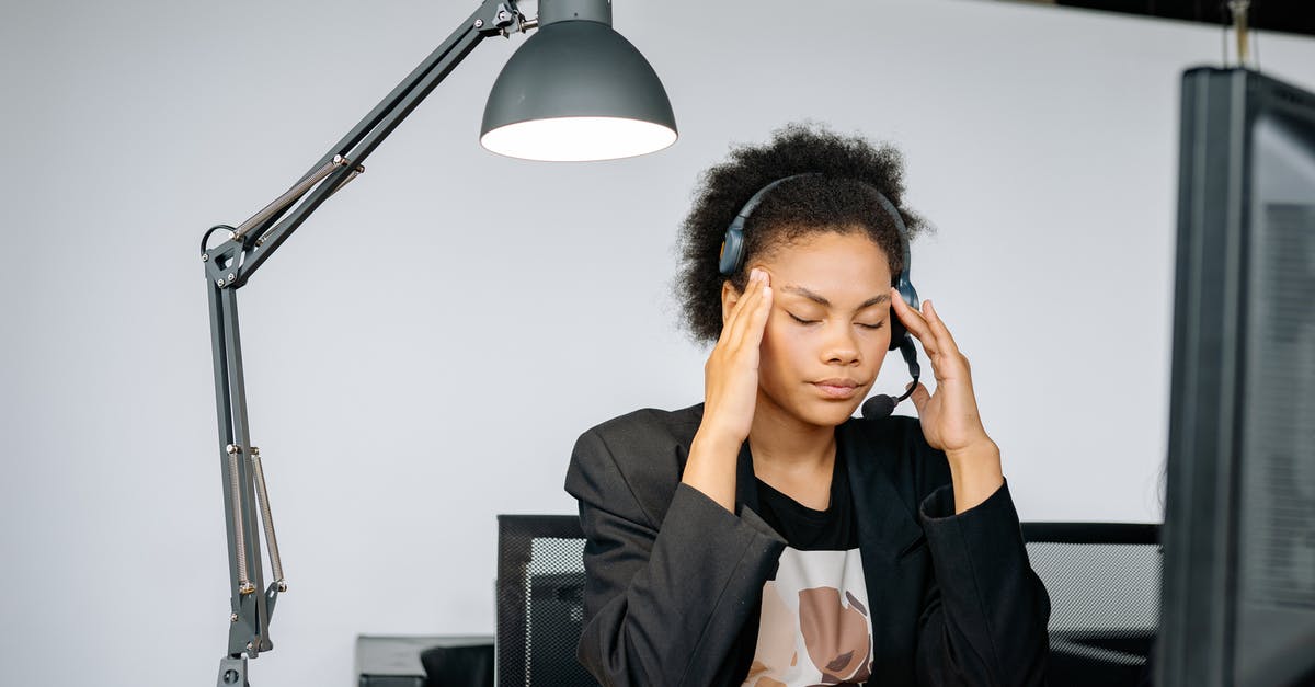 Did this customs agent attempt to plant contraband on me? [closed] - A Tired Woman Massaging Her Head