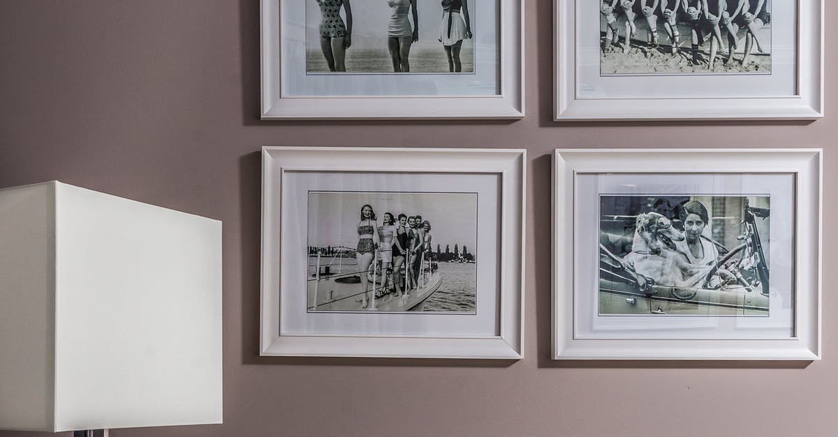 Different Details on Previous Passport - Collection of framed photos on wall