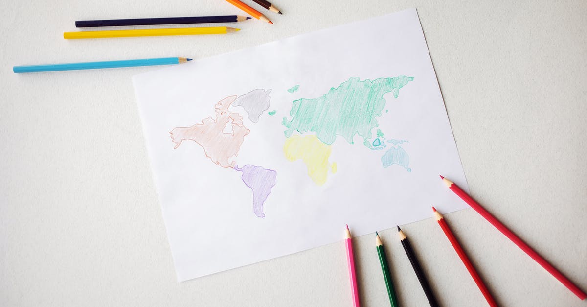 Different location for H1B visa than DS160 [closed] - World map drawn on paper sheet near colorful pencils