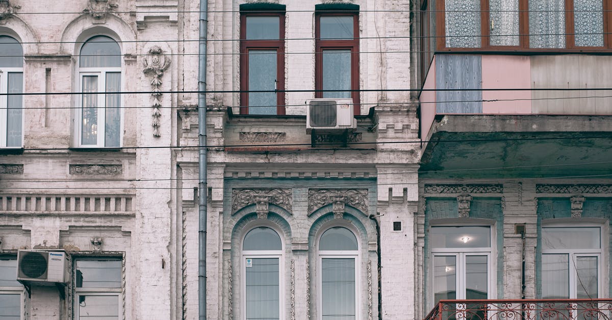 Different name in Passport and Residence Permit - Facade of old stone building in classic style