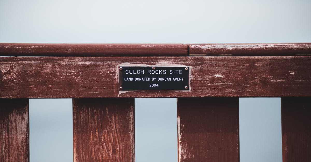 Dingo fence - how to visit? - Nameplate with text on wooden fence