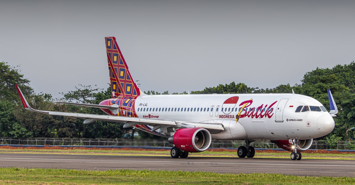 Discrepancies between flight comparison websites and airlines - A Batik Airline Airplane on the airport Runway